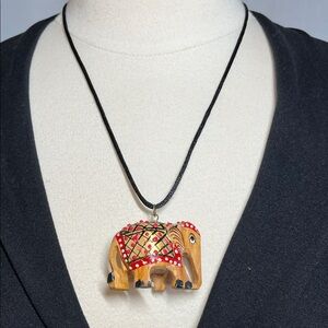 Wooden Elephant pendant on a black satin necklace -